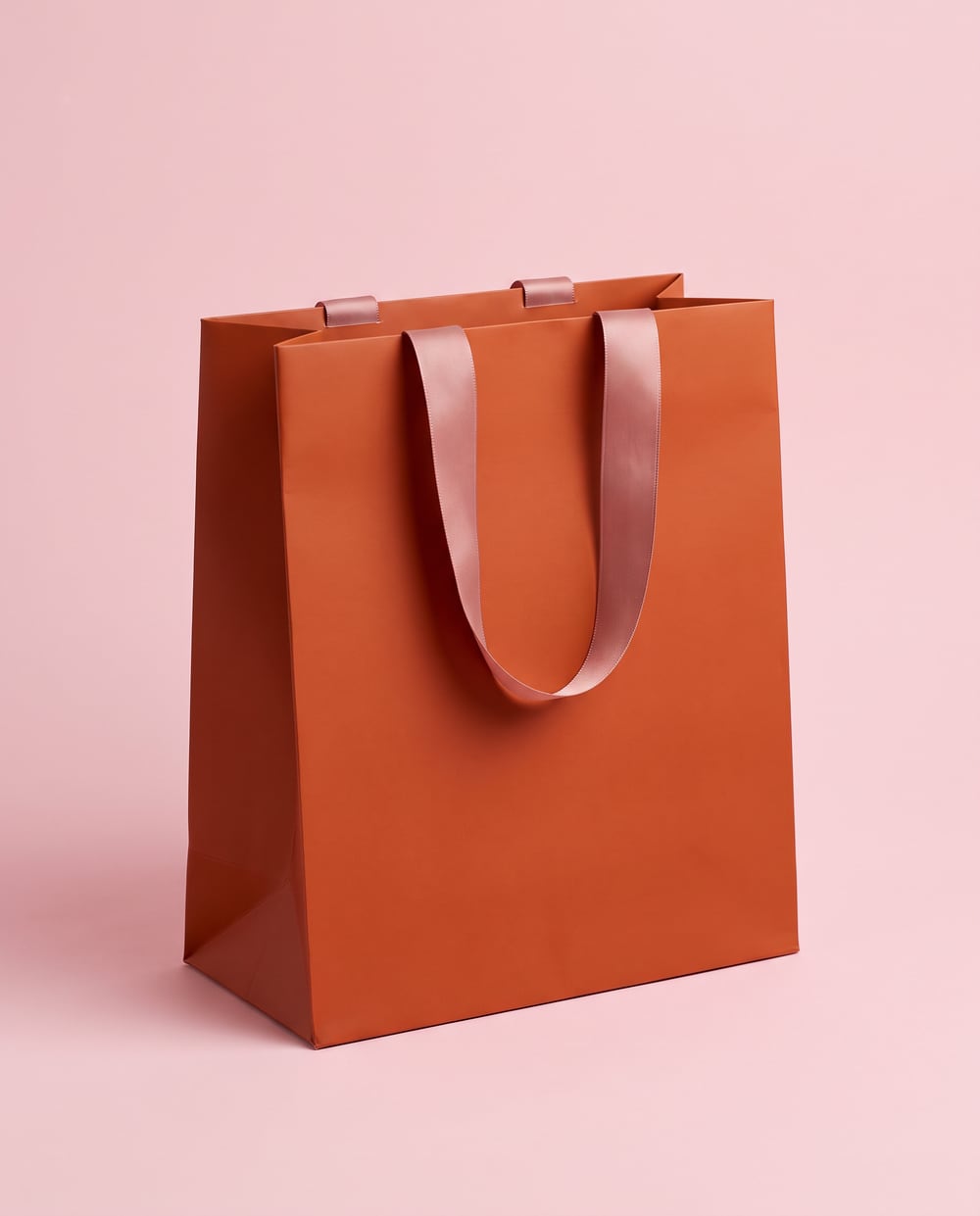 Terracotta soft-touch laminated bag with satin ribbon handles