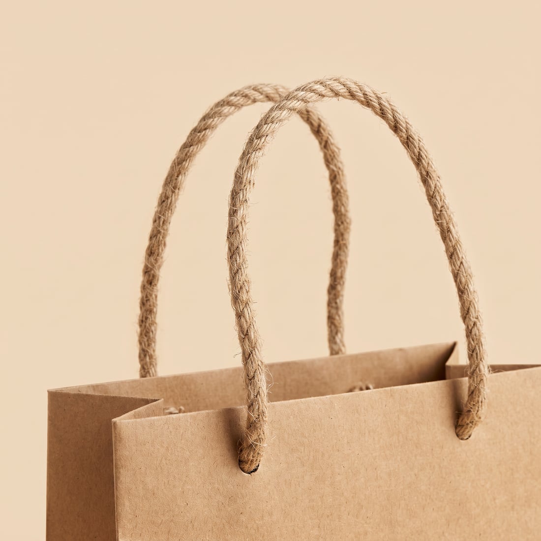Jute rope on a kraft paper bag, close up