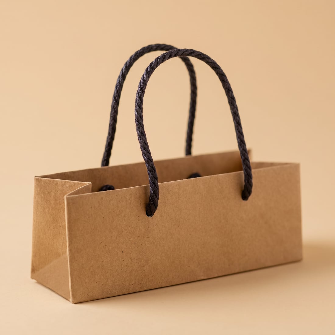 Waxed cotton rope on a kraft paper bag, close up