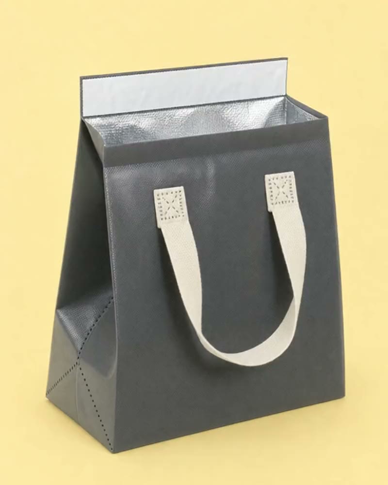 Charcoal insulated tote with a foil lined fold-over flap