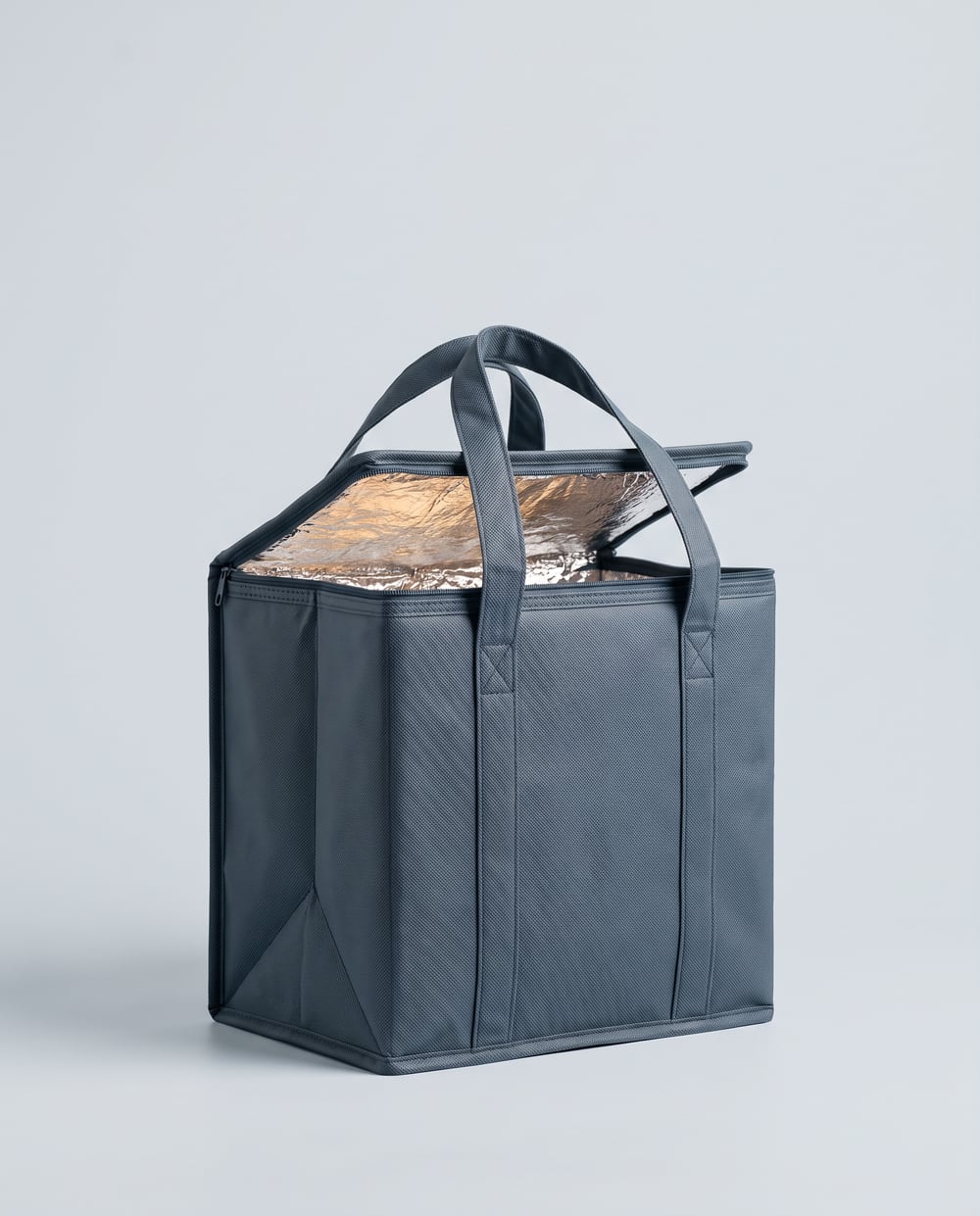 Slate blue insulated thermal bag, flap open showing the foil lining